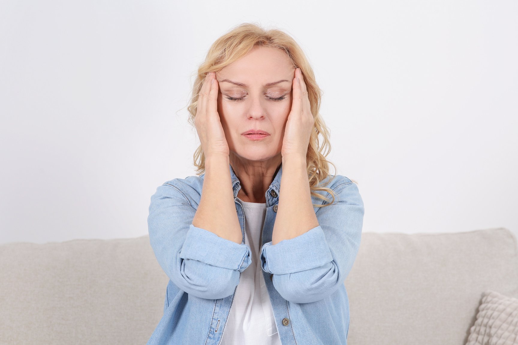 Woman Suffering from Headache Indoors. Hormonal Disorders